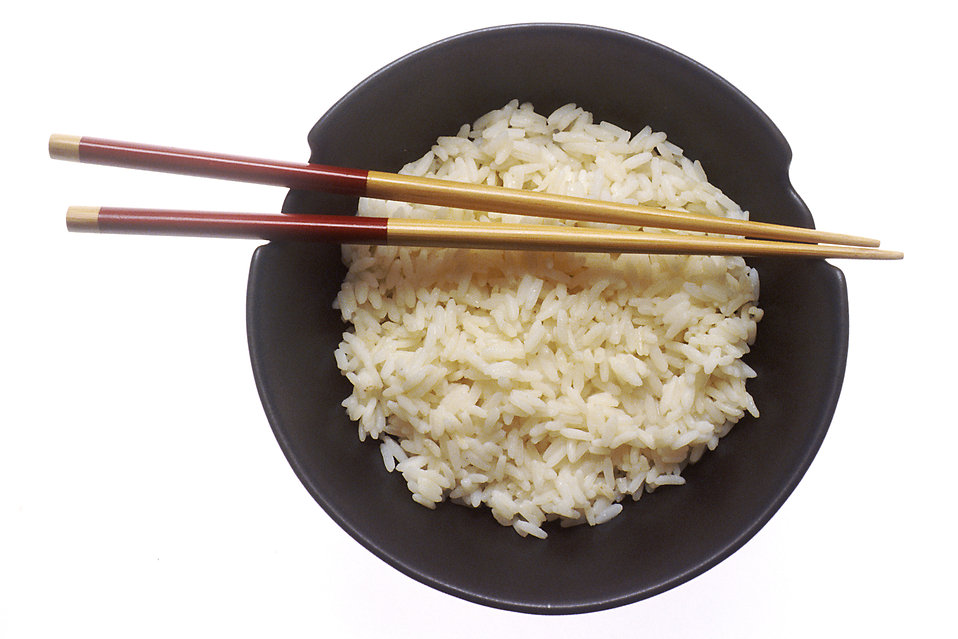 Image: A bowl of rice with two chopsticks laid over it